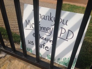 Residents put up "thank you" sign to cops who attacked teens.