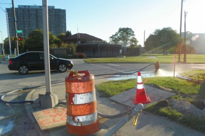 This hydrant, connected by tubing to an unknown underground line, has been spraying large amounts of water for two weeks. Other hydrants along E. Jefferson have been observed doing the same.