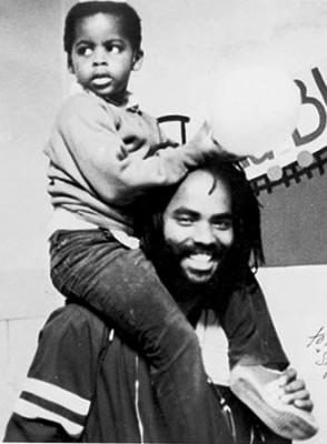 Political prisoner Mumia Abu Jamal with son in earlier years.