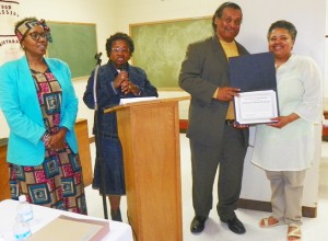 DAREA officers (l to r) Cecily McClellan, Yvonne Williams-Jones, and Bill Davis present one of six WARRIOR awards to Monica Lewis-Patrick of We the People of Detroit, during prayer breakfast June 27, 2015.