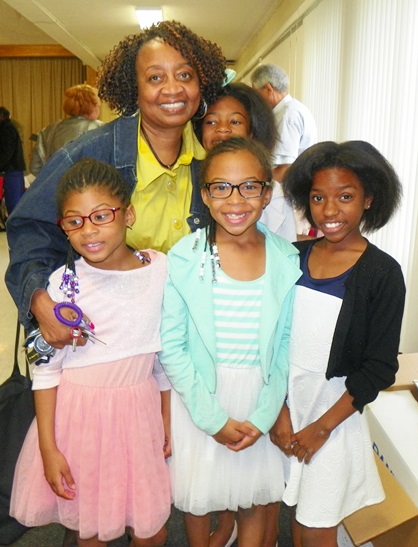 At prayer breakfast, children to whom Detroit water is life: (l to r) Christa Dailey, 7, Alyse Dailey, 8, Amiah Sanders, 11; in rear, Ramona Hall and Tayla Dailey, 10.
