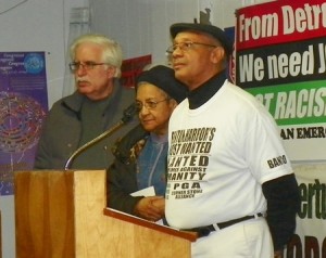 Marian Kramer of MWRO (center), flanked by Dave Sole of Moratorium NOW! and Rev. Pinkney. announces Dec. 6 strategy meeting in Detroit.