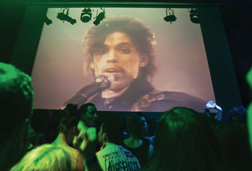 A crowd pays tribute to Prince inside First Ave where “Purple Rain” was filmed late, April 21,in Minneapolis. Photo: AP/Wide World photos
