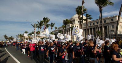 Members of labor unions last year marched past the capitol in San Juan, Puerto Rico against an austerity plan to help the island's debt crisis.