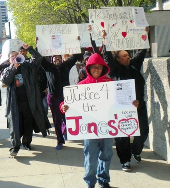 Rafael Jones, 14, leads march for Justice for Aiyana and Charles Jones April 23 2012 at Frank Murphy Hall in downtown Detroit, grandmother Mertilla Jones at left, aunt LaKrystal Sanders at right.