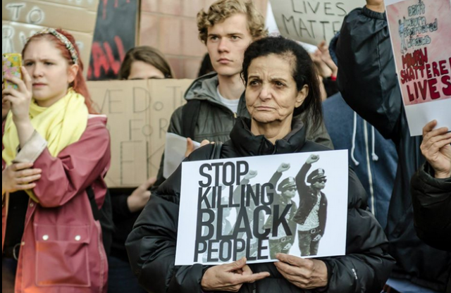 Rasmea Odeh, a long-time activist in Chicago after her immigration to the U.S., participates in protest against U.S. killings by police.