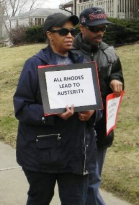 Richard Clay (r) marches with Jan Frazier at Rhodes protest March 12, 2016.