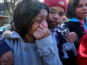 Protester weeps as demonstrations continued over the weekend,