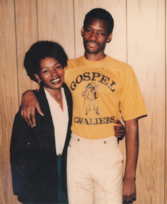 Rosie Lewis with her son Charles Lewis in 1977, shortly after his incarceration. He is wearing a T-shirt from a prison band called "The Gospel Cavaliers."