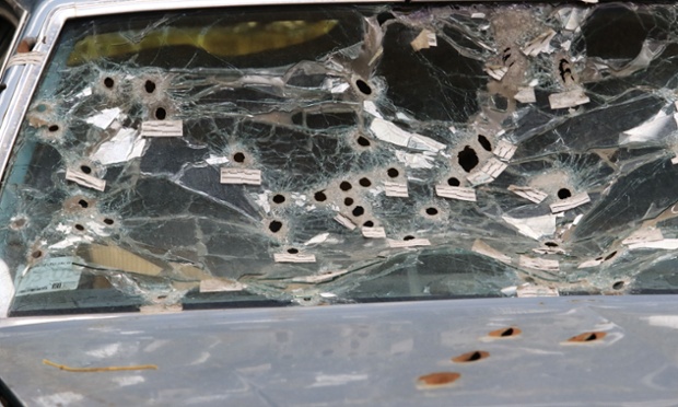 The front windshield of the car driven by Timothy Russell is shown Friday, April 10, 2015, in Cleveland. Cleveland police officer Michael Brelo, 31, is being tried on two counts of voluntary manslaughter in the November 2012 deaths of Russell, 43, and Malissa Williams, 30, after a high-speed chase. The defense attorney's, prosecuting attorney and the judge visited the warehouse where the car and two police cruisers involved in the chase are stored. (AP Photo/Aaron Josefczyk, Pool)