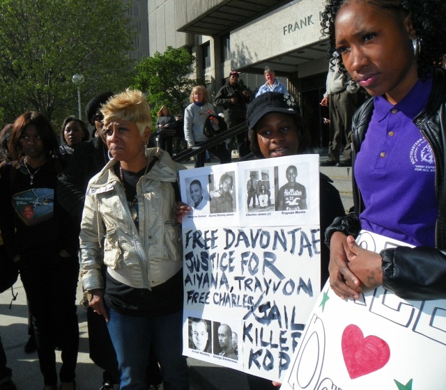 Taminko Sanford-Tilman (left) weeps at joint rally for justice for her son Davontae, Aiyana and Charles Jones, Travyon Martin April 23, 2013.