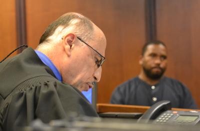 Black defendant (right)being arraigned by 19th District Judge Sam Salamey Photo by Joe Slezak