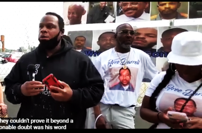 Alsham Haleem calls for freedom for Willie Merriweather June 4, 2021. Family members of Darrell Ewing at at right.