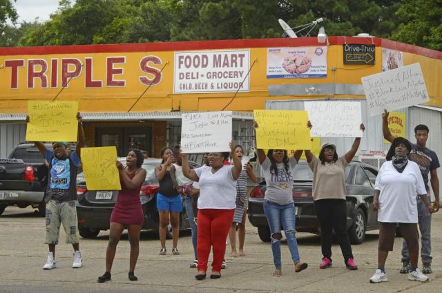 Friends and family protest outside store where cops killed Sterling. Photo: The Advocate
