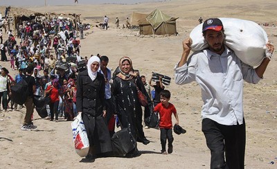 Syrian civilian refugees fleeing ISIS-led attacks.