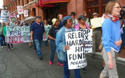 DAREA members participate in tax foreclosure protest outside Register of Deeds office.
