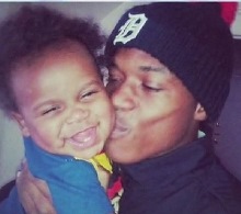 Terrance Kellom with baby son before he was executed by police task force in April, 2015.