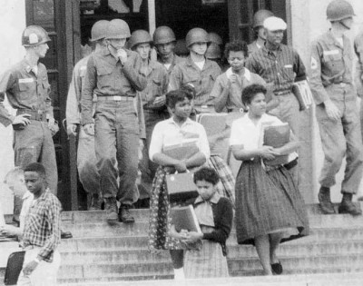 Federal troops intervene at presidential order to allow "The Little Rock Nine" into Arkansas schools during civil rights movement. Ironically, Pres. Bill Clinton interrupted his first campaign to return to Arkansas to preside over the execution of a Black, mentally challenged man.