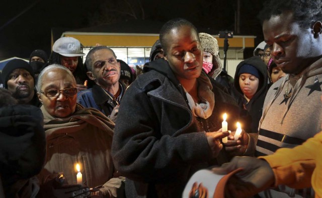Toni Martin and Jerome Green, parents of Antonio Martin, at candelight vigil after killing.