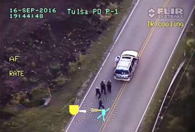 Shot from police helicopter video shows Crutcher at door of his car just before being killed.