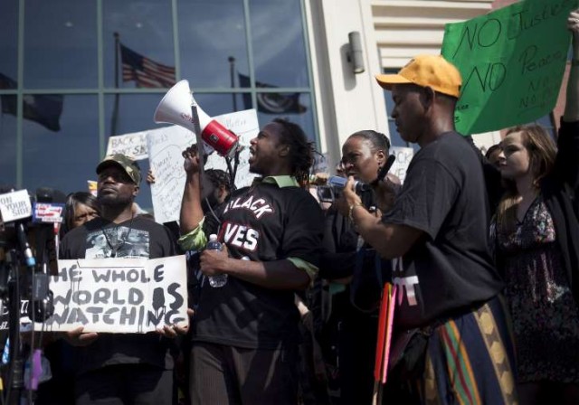 Protesters in Charleston after white cop Michael Slager shot Black man Walter Scott, 51, in the back to death in April, 2015.