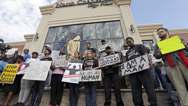 Protesters condemn white cop's murder of Walter Scott outside N. Charleston city hall.