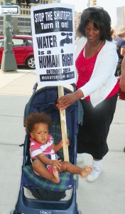 Linda WIllis and grandchild protest mass water shut-offs in Detroit Aug. 15, 2014.