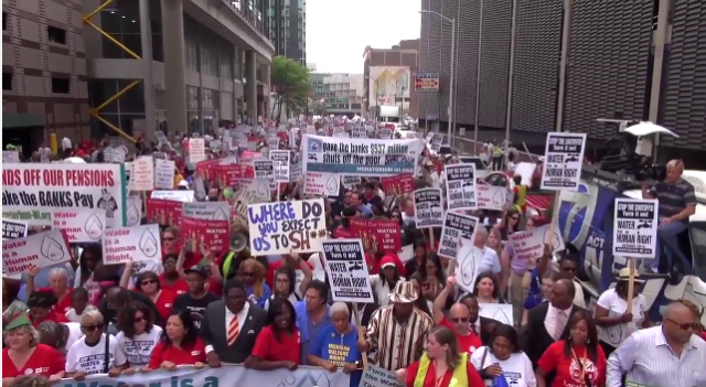 Thousands including many from Canada massed in downtown Detroit July 18, 2014 to protest shut-offs.