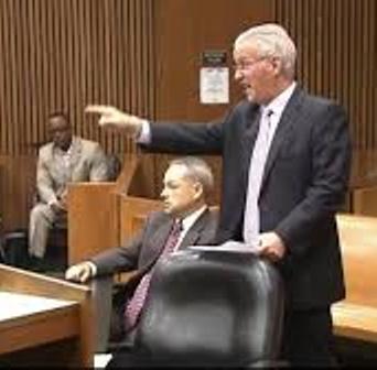 Defense attorney Steve Fishman angrily confronts Aiyana's aunt LaKrystal Sanders during her testimony as Joseph Weekley watches.