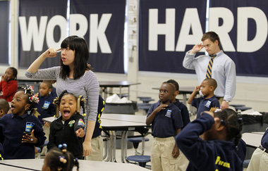 Teachers have young Black students pledge to "Work Hard" at RSD elementary school.