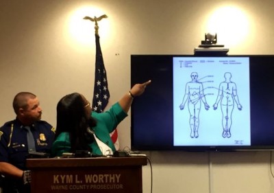 Kym Worthy points to diagram of body of Terrance Kellom, 19, during press conference Aug. 19 declaring no charges will be brought In his death.