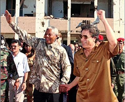 South African President Nelson Mandela and Libyan Pres. Muammar Gadhafi after first U.S. bombing; Hillary Clinton later gave the orders to assassinate Gadhafi in second wave of US/NATO annihilation of Libya.